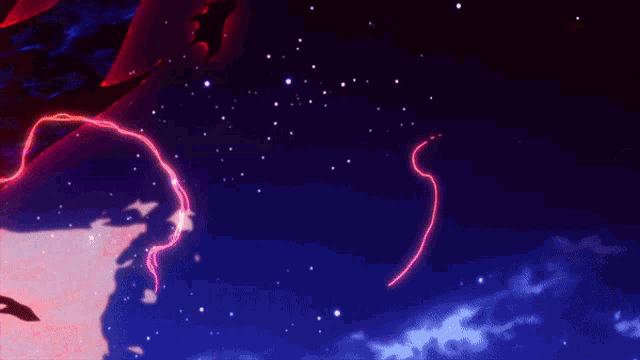 a person is standing in front of a large red and purple fire .