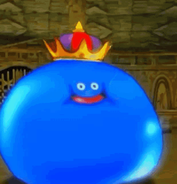 a blue slime with a crown on its head is sitting in a room .