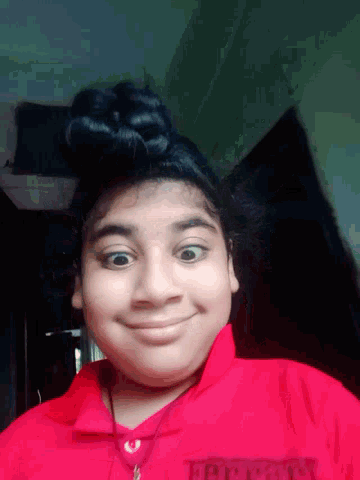 a girl wearing a red shirt that says happy