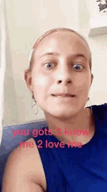 a woman in a blue tank top is making a funny face and says `` you gots 2 know me 2 love me ''