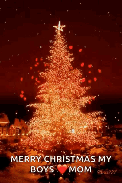 a christmas tree with a star on top is lit up and says merry christmas my boys mom .