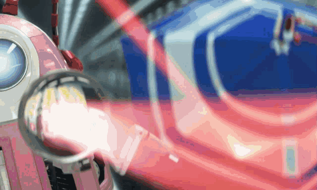 a close up of a robot with a red light coming out of its mouth
