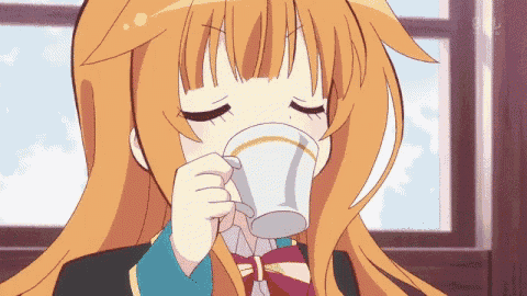 a girl with long orange hair drinking from a cup