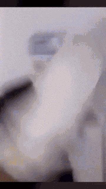 a blurred image of a person 's face with a white background