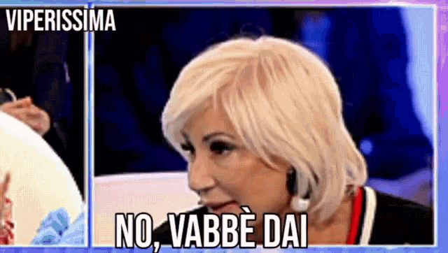 a woman with blonde hair says no vabbe dai in a foreign language