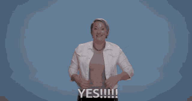 an older woman with her arms outstretched says yes !!!