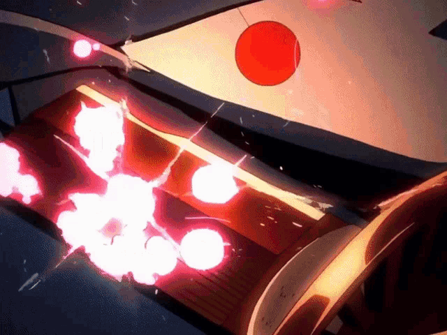 a red circle is hanging from the ceiling above a red explosion