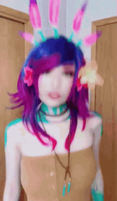 a woman with purple hair and flowers in her hair is standing in front of a door