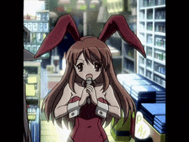 a girl in a red bunny costume holds a microphone