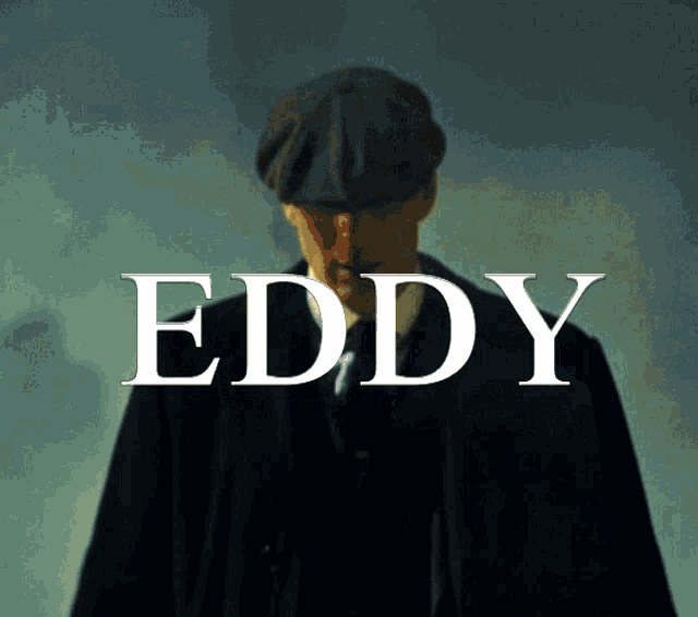 a man in a suit and hat is standing in front of eddy
