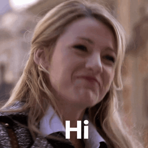 a close up of a woman 's face with the word hi written on her face
