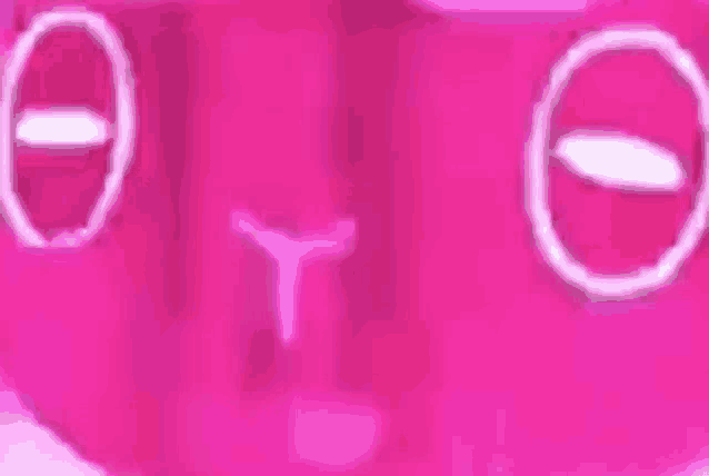 a close up of a pink heart with circles on it