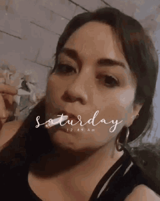 a woman 's face is shown with the words saturday written above her