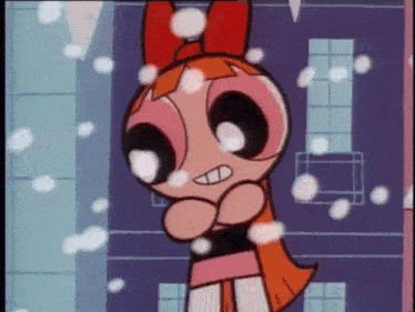 blossom from the powerpuff girls is standing in the snow with her arms crossed .