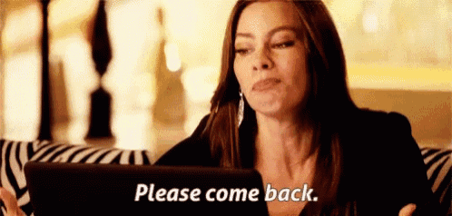 a woman is sitting on a couch looking at a tablet and saying please come back .