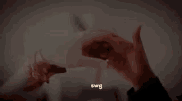 a person holding another person 's hand with the word swg on the bottom right