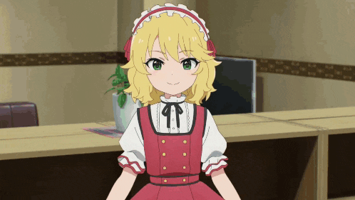 a girl with blonde hair and a red dress is smiling