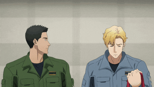 two men in military uniforms are standing next to each other and one has a name tag that says ' a. '