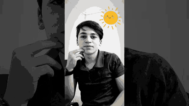 a black and white photo of a young man with a smiling sun