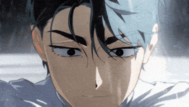 a close up of a person 's face with a serious look on his face