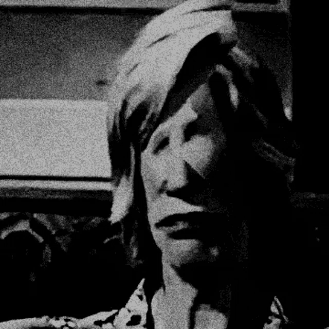 a black and white photo of a woman 's face