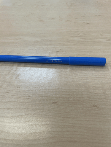 a blue pen with the number 10 on it sits on a wooden table
