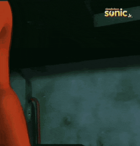 a cartoon character from sonic jr. is being held by someone