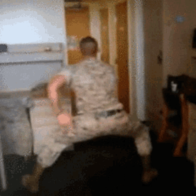 a blurred image of a man in a military uniform