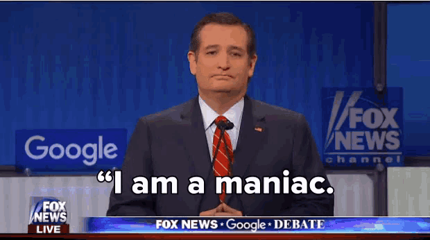 a man in a suit and tie is standing in front of a fox news sign