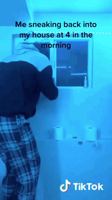 a man sneaking back into his house at 4 in the morning with a tiktok logo