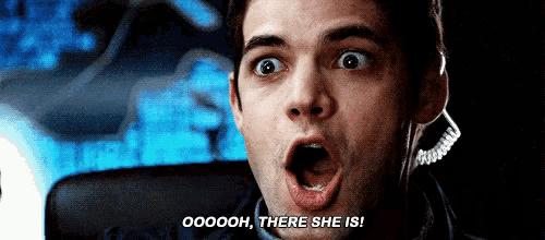 a man with a surprised look on his face is saying " ooooh there she is "