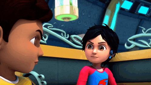 a boy and a girl are standing next to each other in a room