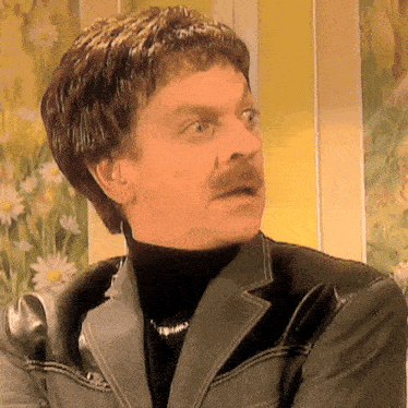 a man with a mustache is wearing a black turtleneck and a leather jacket