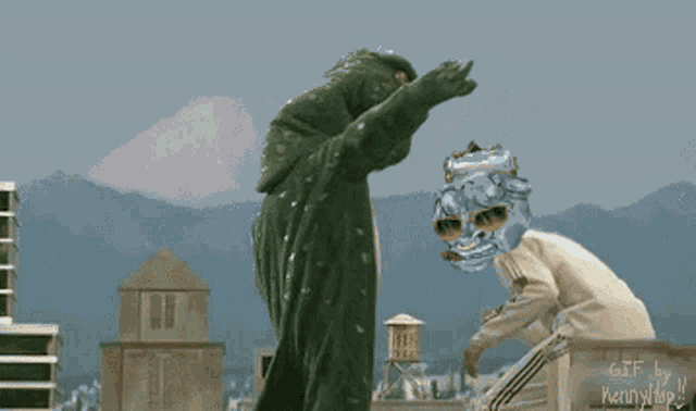 a gif of a monster and a person with a mask on their face