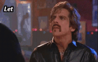 a man with a mustache is pointing at something with the words let me hit you with some knowledge above him