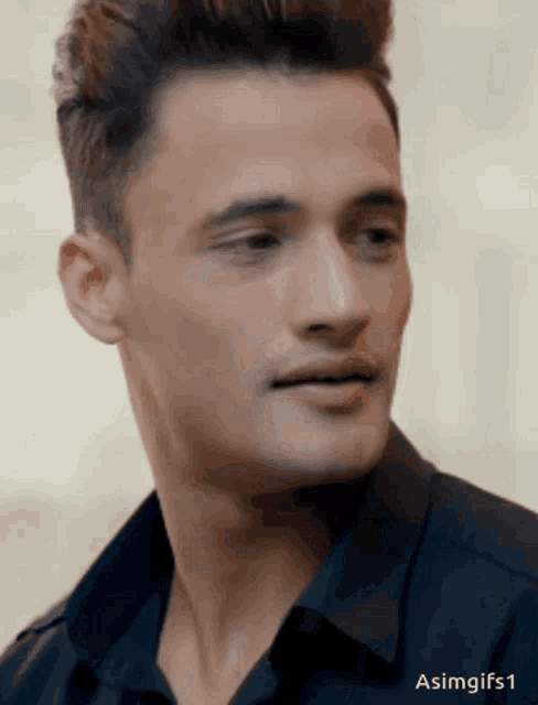 a close up of a man 's face with the hashtag asimgifs1