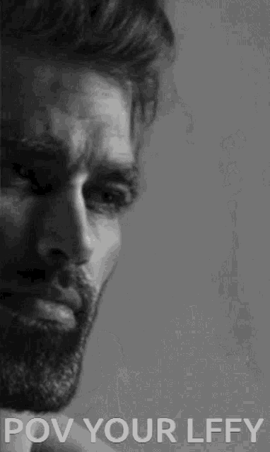 a black and white photo of a man with a beard and the words pov your lffy below him .