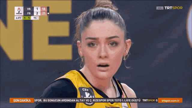 a tv screen shows a woman wearing a jersey with cev on it