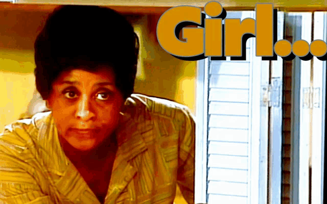 a woman stands in front of a window with the words girl written on it