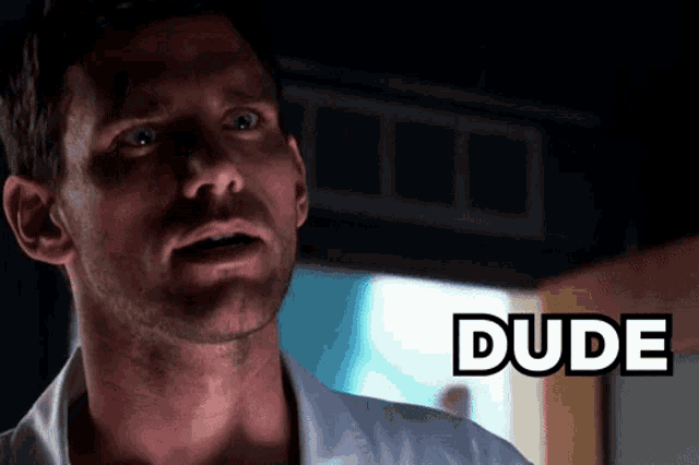 a close up of a man 's face with the word dude on the bottom