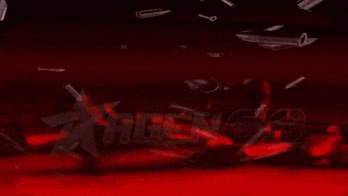 a red light is shining on a dark red background with the word agent on it .