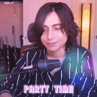 a man in a striped shirt is sitting in front of a microphone with the words party time written on the bottom .