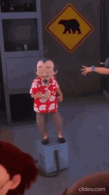 a cartoon character is standing on a box in front of a bear sign .