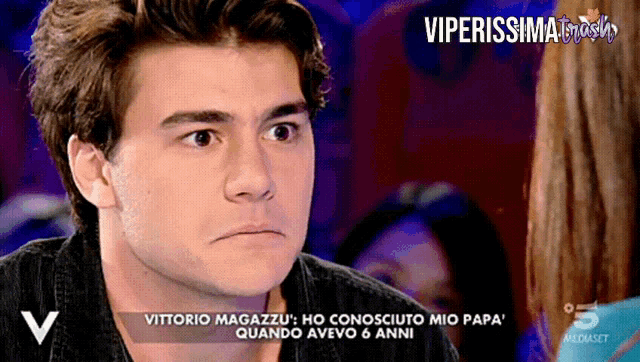 a tv screen shows a young man talking to a woman and says viperissima trash on the bottom