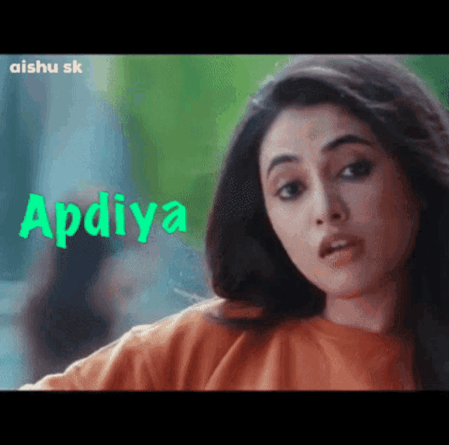a close up of a woman 's face with the word apdiya written in green