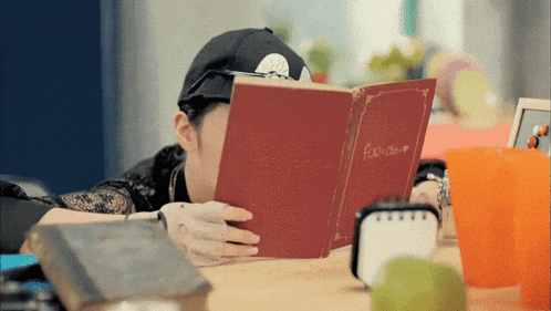a person is reading a book called fool 's diary