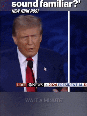 donald trump is giving a speech in front of a live cnn news screen