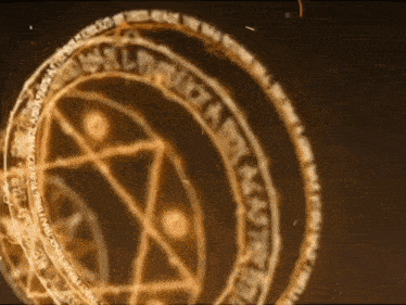a close up of a circle with a pentagram in the middle