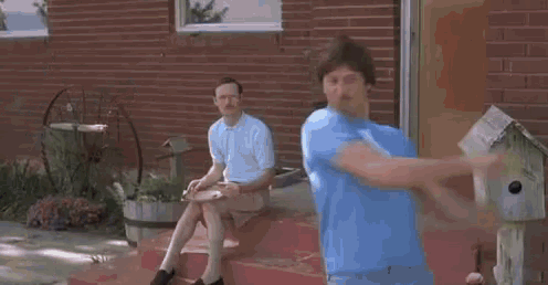two men are riding a bike on a dirt road and one of them is talking about groans .