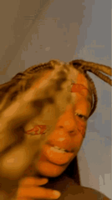 a close up of a woman 's face with a flower on it .